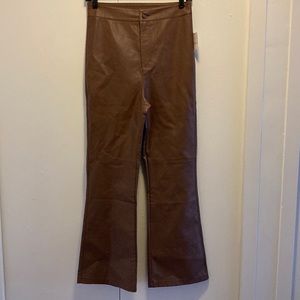Brown vegan leather pants. Flattering slight flare at bottom